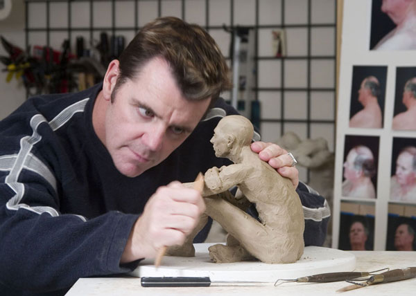 Gregory sculpting the Truth-seeker sculpture